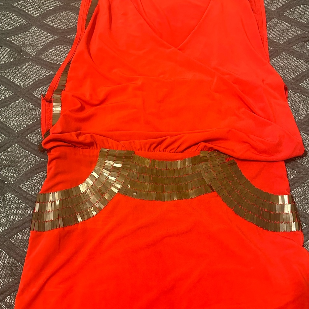Mini Bebe dress. Cute design on the waist and both sides.